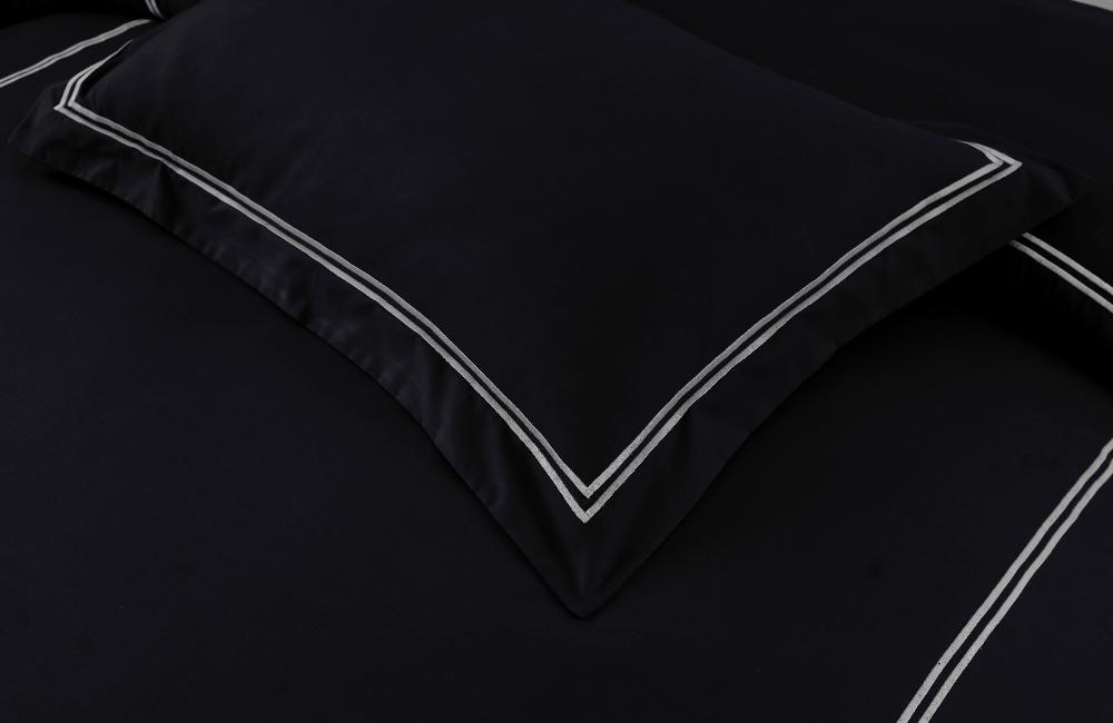 Black Baratta Stich luxury Duvet Cover made from premium cotton, including a king Duvet Cover and pillow cases. Perfect for elegant bedding, available online in Pakistan